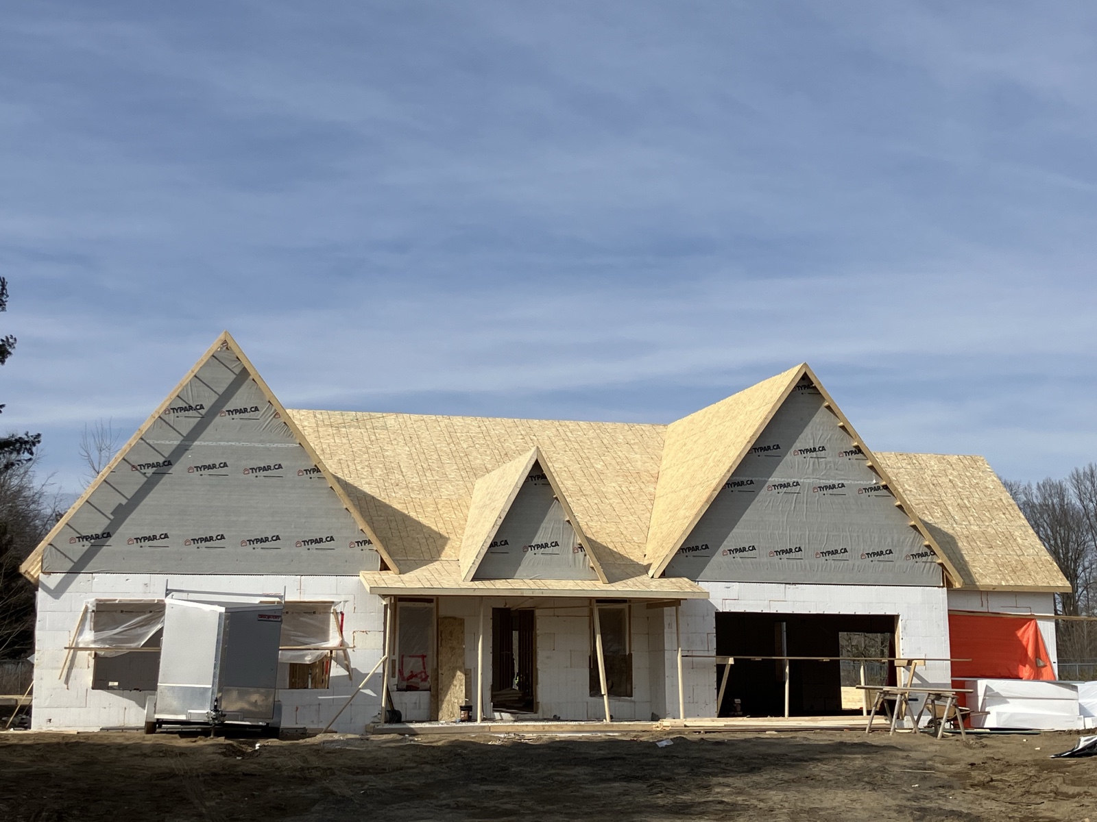 Traditional custom home roof framing in progress