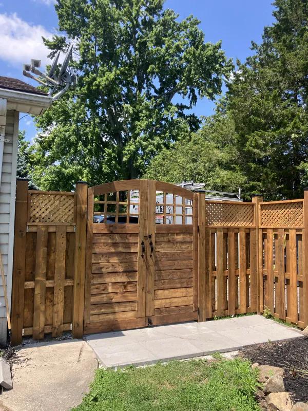 Custom double wood gate with lattice fence panels